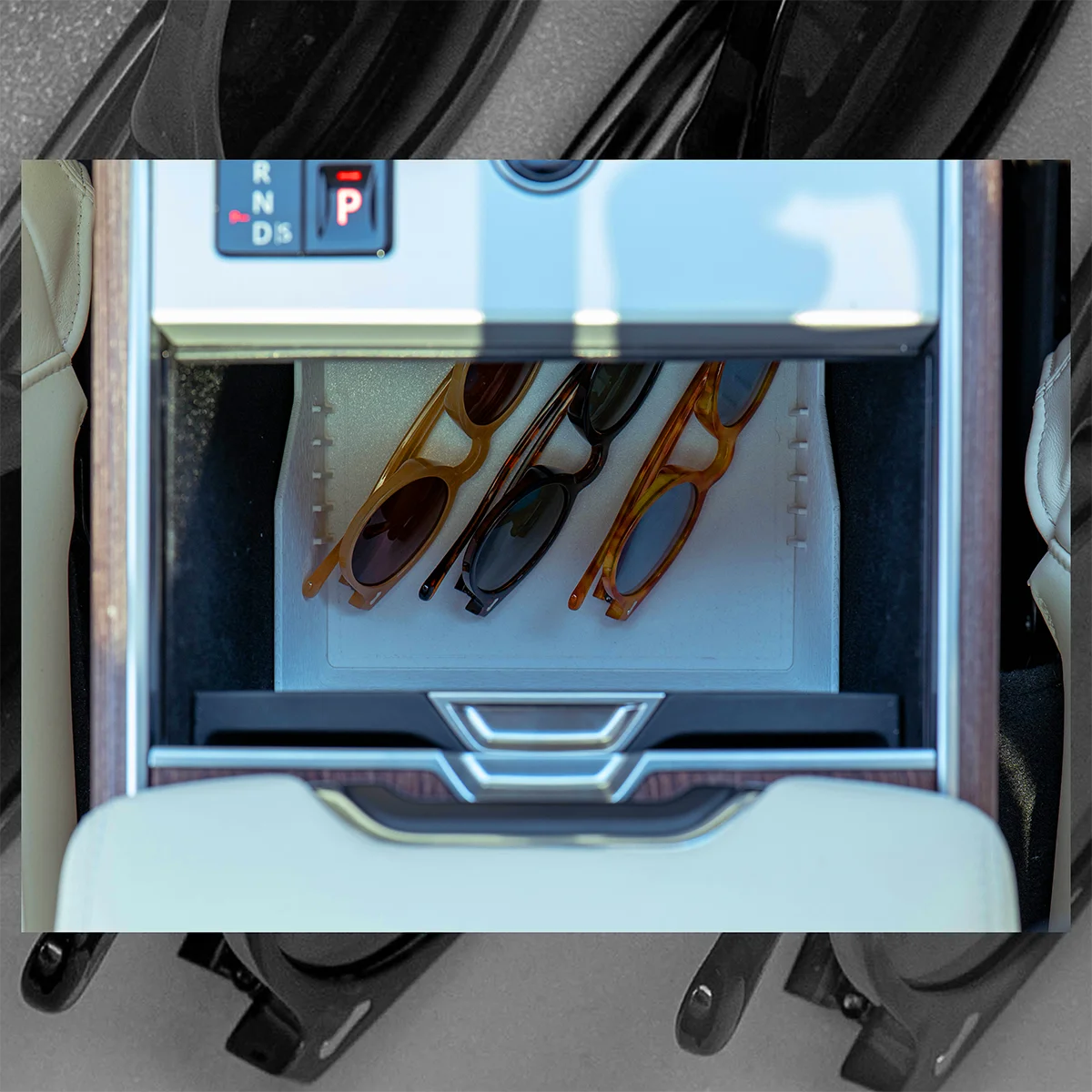 Range Rover Hidden Storage Organizer beneath the sliding cupholders