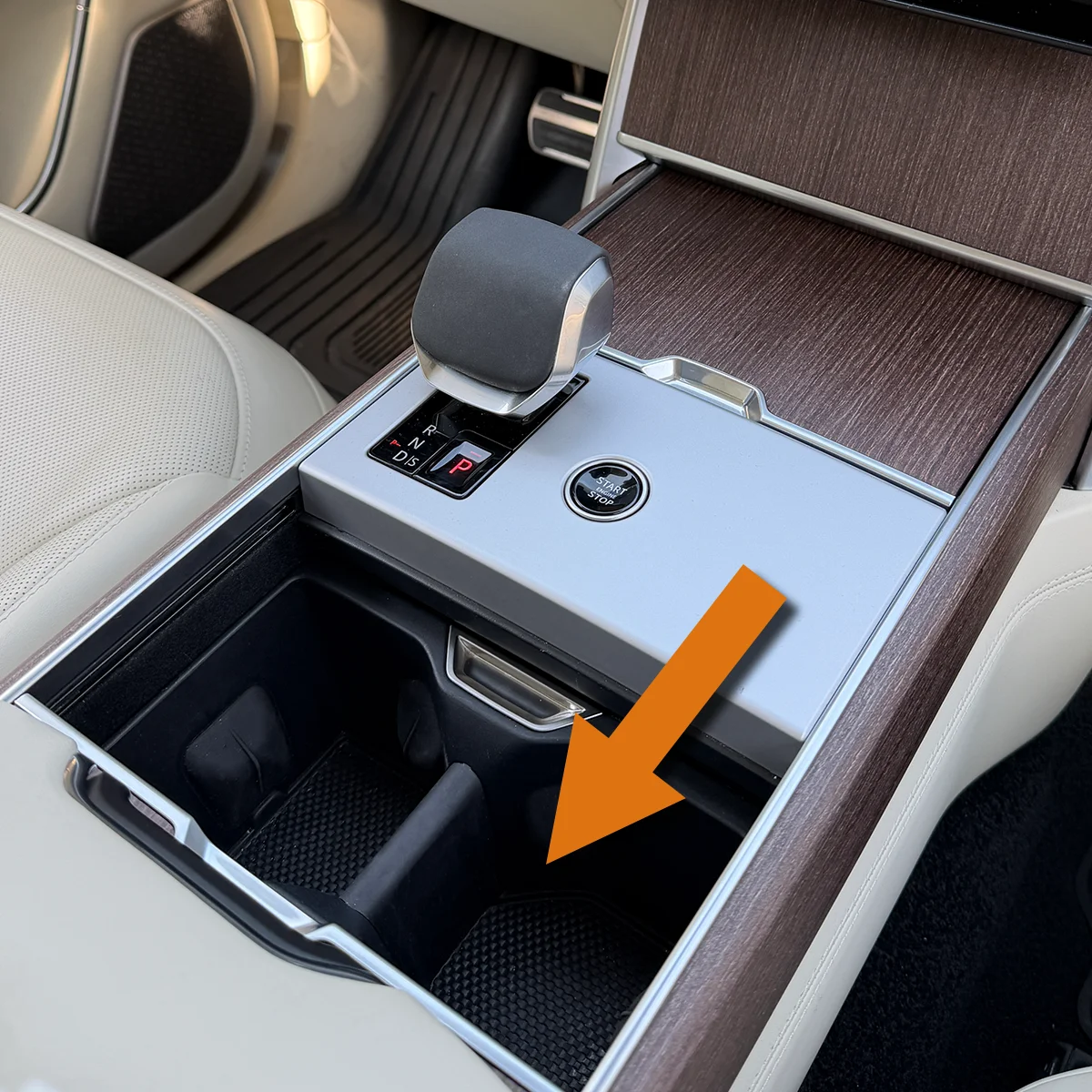 Range Rover cupholders sliding back to reveal the hidden storage area