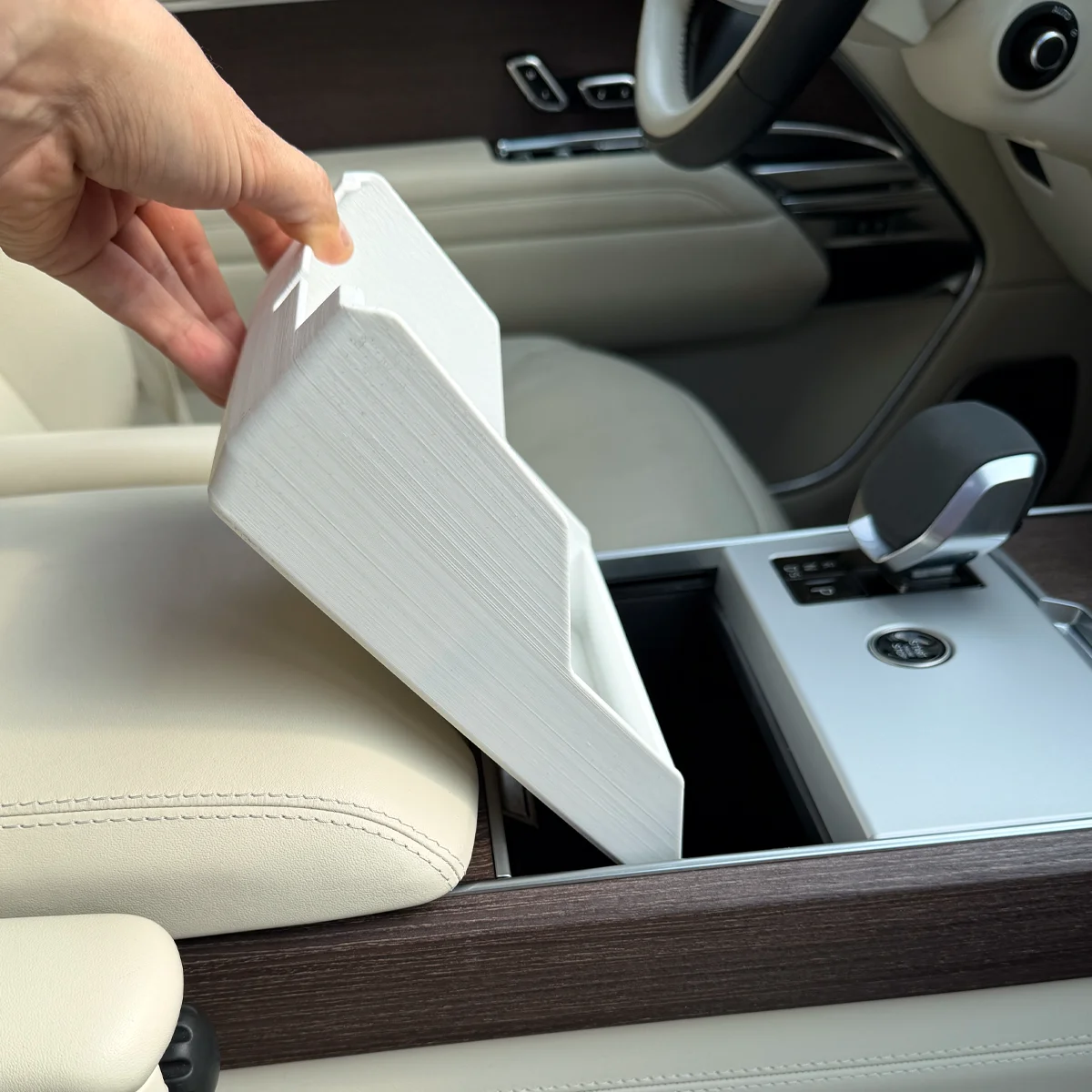 Range Rover Hidden Storage Organizer beginning to enter the compartment