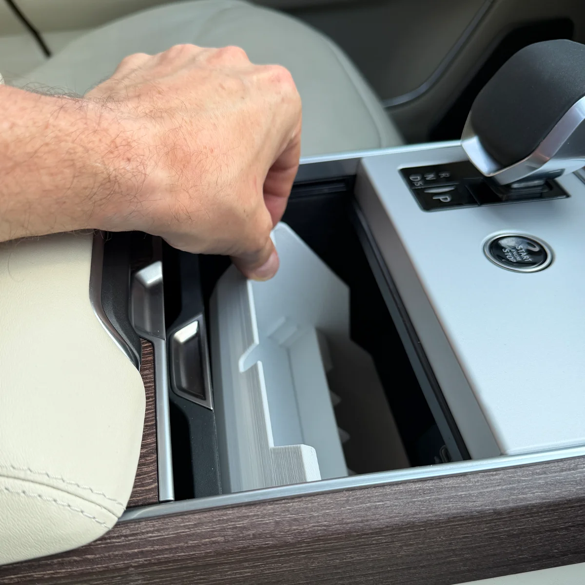 Range Rover Hidden Storage Organizer finding its position in the compartment