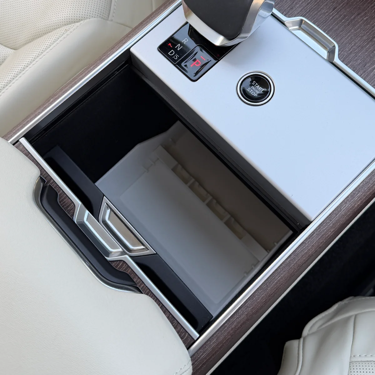 Range Rover Hidden Storage Organizer installed with the cupholder moving freely